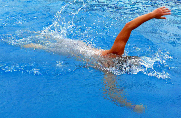 Man swimming in a pool